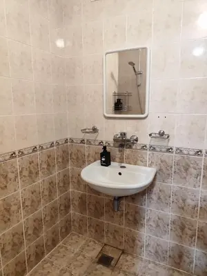 a bathroom with a sink and a mirror at Podslon Varna Vibes in Varna City