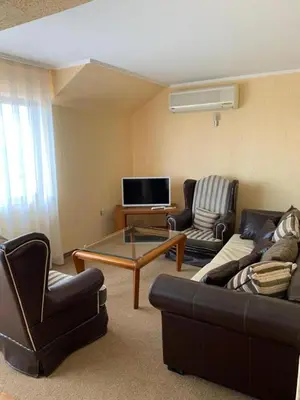 a living room with two couches and a coffee table at Elizabeth Beach Apartments in Nesebar