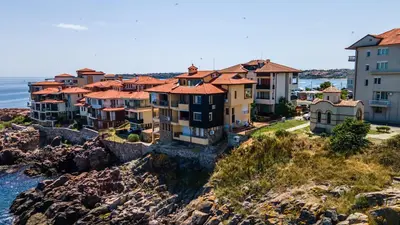a group of houses on a cliff near the water at Sozopol Apartment with Sea View in Sozopol