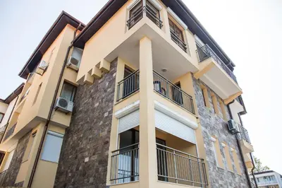 a building with balconies on the side of it at Sozopol Apartment with Sea View in Sozopol