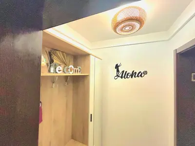 a room with a hallway with a sign on the wall at Studio Aloha in Burgas City
