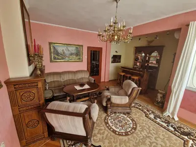 a living room filled with furniture and a chandelier at ap Malinov 15 in Varna City