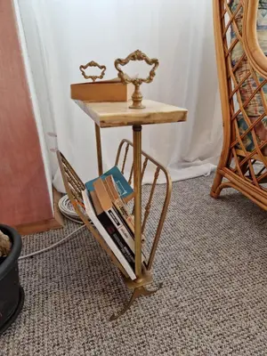a small table with a book shelf and a scale at ap Malinov 15 in Varna City