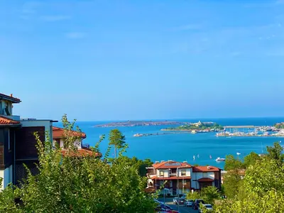 a view of a bay with houses and the water at Summer Breeze Park Apartment, Santa Marina Holiday Village, Sozopol in Sozopol