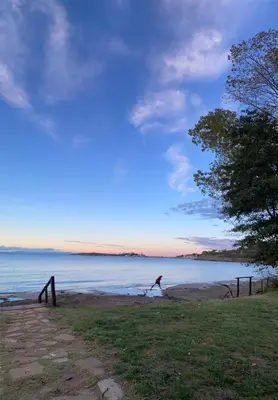 a person walking on the beach near the water at Summer Breeze Park Apartment, Santa Marina Holiday Village, Sozopol in Sozopol