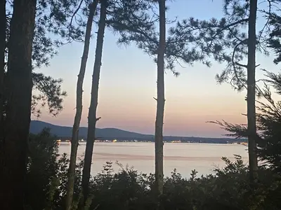 a view of the water through the trees at Summer Breeze Park Apartment, Santa Marina Holiday Village, Sozopol in Sozopol