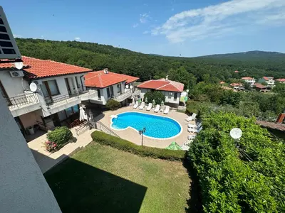 an aerial view of a house with a swimming pool at Guest House Primorsko - Uzundzha in Primorsko