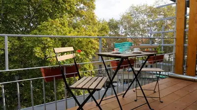 a balcony with a table and two chairs on it at Varna Attic Studio - Варна Атик Студио in Varna City