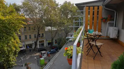 an apartment balcony with a view of a street at Varna Attic Studio - Варна Атик Студио in Varna City