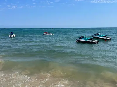 a group of boats floating in the water at Phoenix APARTMENT Апартамент Феникс in Sveti Vlas