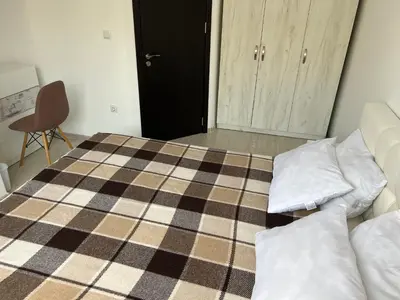 a bedroom with a bed with two pillows on it at Phoenix APARTMENT Апартамент Феникс in Sveti Vlas