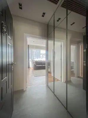 a room with a glass door and a living room at Central Apartment in Varna in Varna City