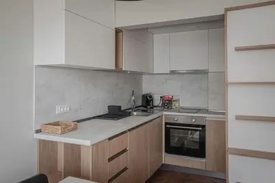 a kitchen with a sink and a stove top oven at Central Apartment in Varna in Varna City