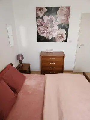 a bedroom with a bed and a painting on the wall at Úchvatný výhled na moře in Aheloy