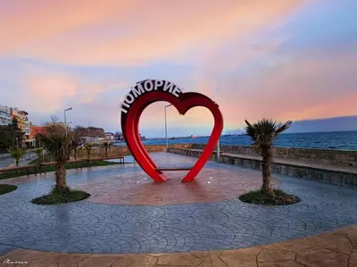 a heart sculpture in the middle of a beach at Apartament Marinela 2 in Pomorie