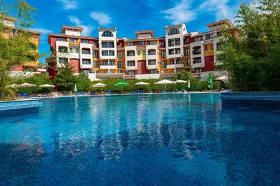 a swimming pool in front of a hotel at Menada Aheloy Apartments in Aheloy