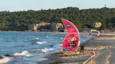 a windsurfing sail on the beach near the water at Kavaci Studio Beach Sozopol in Sozopol