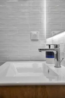 a bathroom sink with a faucet on top of it at The Swing in Burgas City