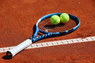 a tennis racket with two tennis balls on it at The Swing in Burgas City