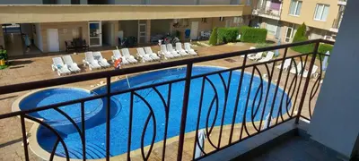 a view of a swimming pool from a balcony at Апартамент Александър in Sunny Beach