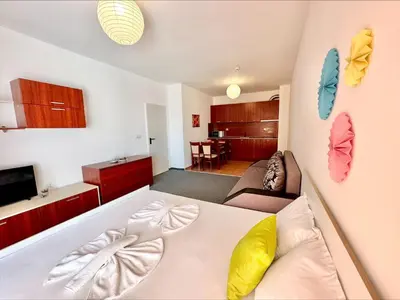a room with a bed and a living room at Menada Apartments in Marina Cape in Aheloy