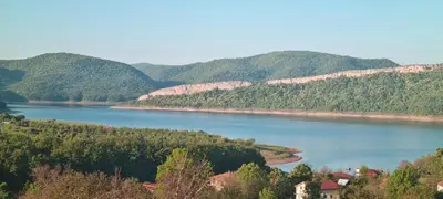 a view of a river with mountains in the background at Eco Lodge St Ignatius Еко лодж Игнажден in Debelets