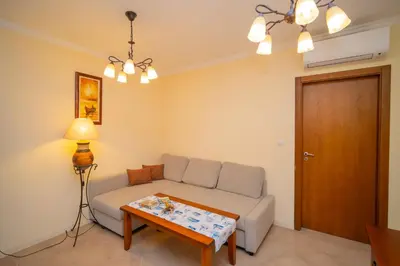 a living room with a couch and a table at SeaRent Dream Home in Santa Marina - 2 bedrooms, 2 baths and a HUGE terrace in Sozopol