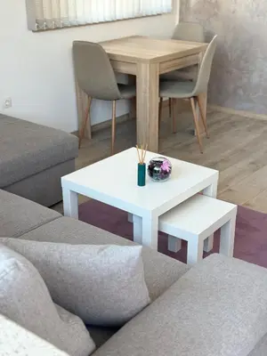a living room with a white table and chairs at Restful Apartment for 4 Guests in Burgas in Burgas City