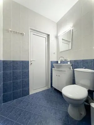 a bathroom with a toilet and a sink at Restful Apartment for 4 Guests in Burgas in Burgas City