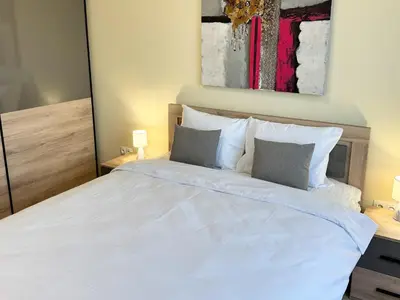 a bedroom with a large white bed with two pillows at Restful Apartment for 4 Guests in Burgas in Burgas City