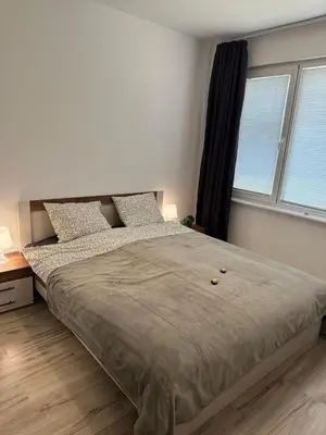 a bedroom with a large bed and a window at Varna Bulgaria 2-Room Apartment Asparuhovo Zelenika Bulgarien Warna 2-Zimmer in Galata