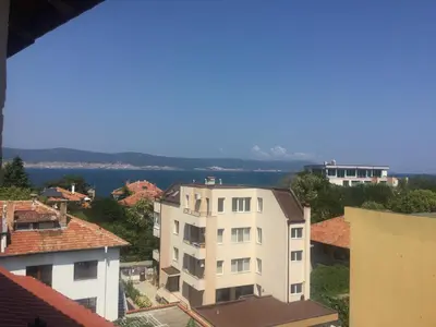 a view of a city with buildings and the water at Sea View Rooms Briz in Nesebar