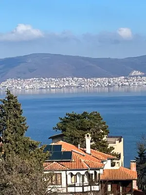 a house with a view of the water and a city at Sea View Rooms Briz in Nesebar