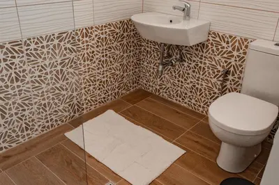a bathroom with a sink and a toilet at July's Guest House in Primorsko