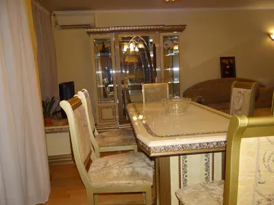a dining room with a table and chairs at Luxury Versailles Apartments Center Opera in Burgas City