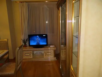 a television sitting on top of a dresser in a room at Luxury Versailles Apartments Center Opera in Burgas City