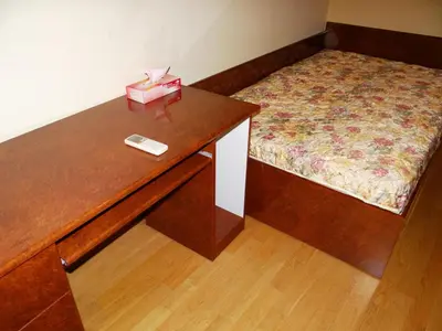a room with a desk with a bed and a box on it at Luxury Versailles Apartments Center Opera in Burgas City