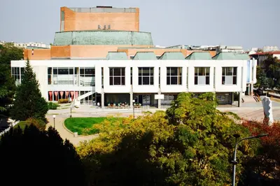 a large white building with a building at Luxury Versailles Apartments Center Opera in Burgas City