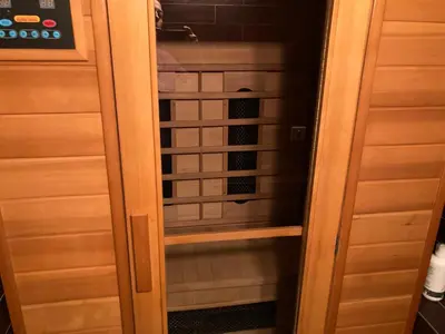 a walk in closet with a glass door at GoodRest Sozopol in Sozopol