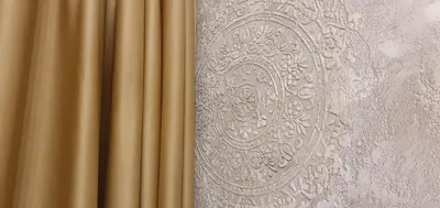 a gold curtain is next to a white wall at Апартамент Злато изглед МОРЕ in Sozopol