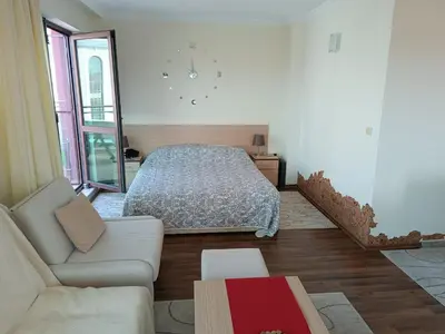 a living room with a bed and a couch at Rooftop Sea View Apartment Sveti Vlas in Sveti Vlas