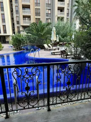 a swimming pool with blue water in a building at Studio CASCADAS FAMILY RESORT in Sunny Beach