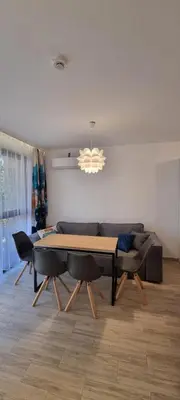 a living room with a table and a couch at Studio CASCADAS FAMILY RESORT in Sunny Beach