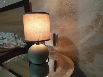 a lamp sitting on top of a glass table at Cozy apartment by Julie in Sunny Beach