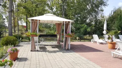 a gazebo with a piano on a patio at Cozy apartment by Julie in Sunny Beach
