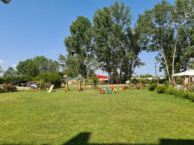 a large park with a playground with people on it at Cozy apartment by Julie in Sunny Beach