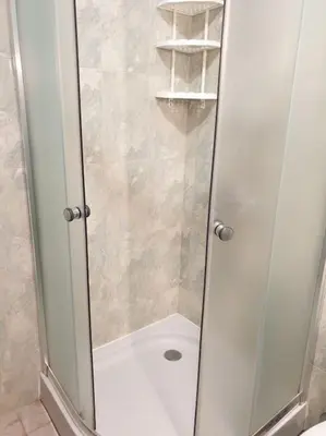 a shower with a glass door in a bathroom at Cozy apartment by Julie in Sunny Beach