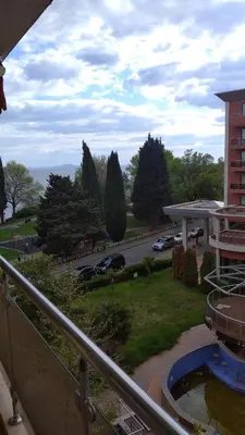 a view of a parking lot and a street with cars at Vadim Apartments in Panorama Beach Vigo Nessebar in Nesebar