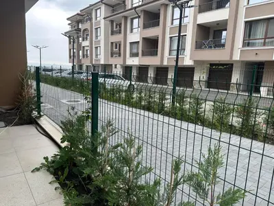 a fence in front of a building at Сарафово Лукс Тераса Първа Линия in Sarafovo