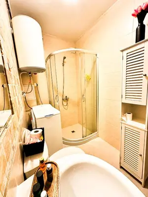 a bathroom with a shower and a toilet and a sink at Студио Каскадас М5 in Sunny Beach